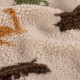 Tissu fourrure sherpa Dinosaures - beige